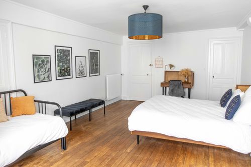 The double bed and sofa bed in the first large bedroom