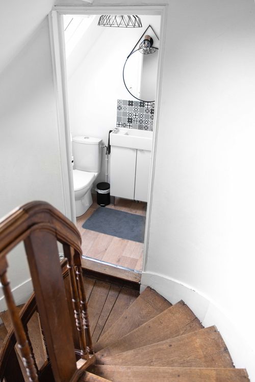 The shower room reached from the stair landing