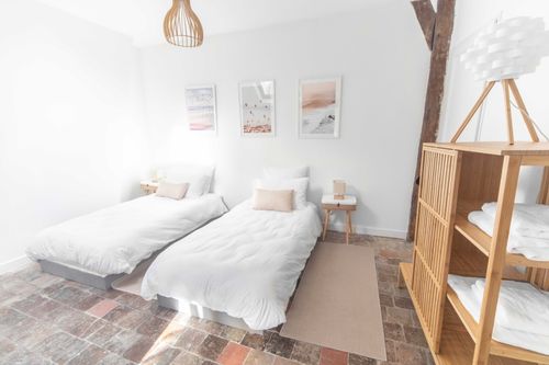 A bedroom with single beds