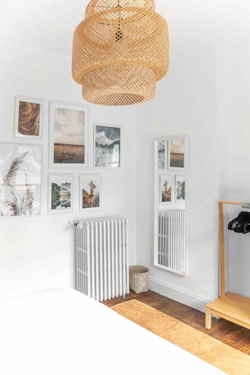 The freestanding mirror and decorative frames in the fifth bedroom
