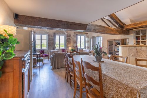 Le Loft’s dining room opening onto the lounge and large windows