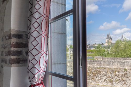 The view from a window at Les Chalands over the rooftops and a church tower in Blois