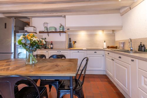The white corner kitchen and dining table
