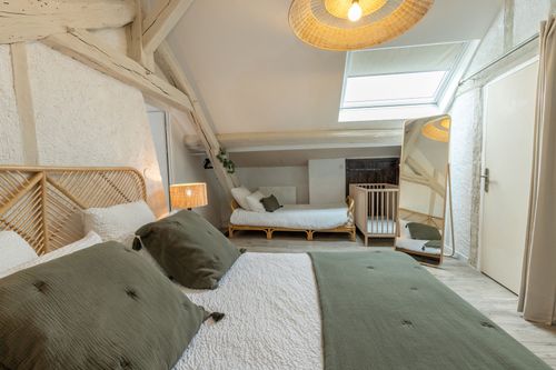 The family bedroom, from the double bed to the beds beneath the roof window