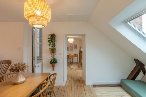 The dining table between the attic lounge and bedroom corridor