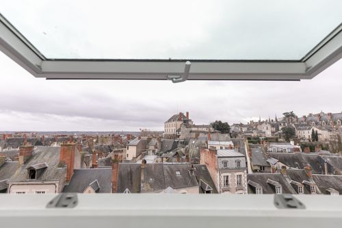 Blois castle on the horizon, seen through the roof window