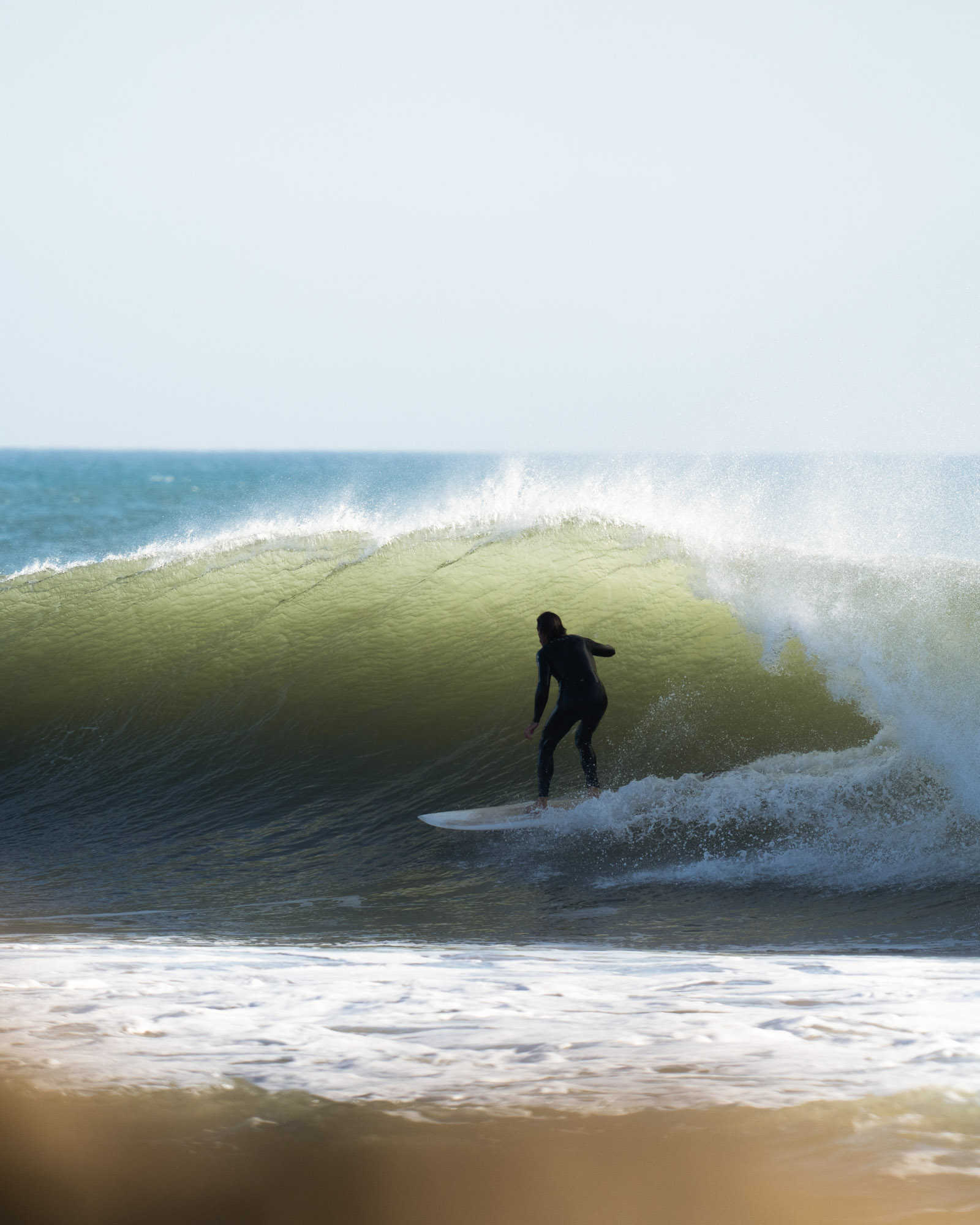 Surfer riding a wave, photographed by I See Waves