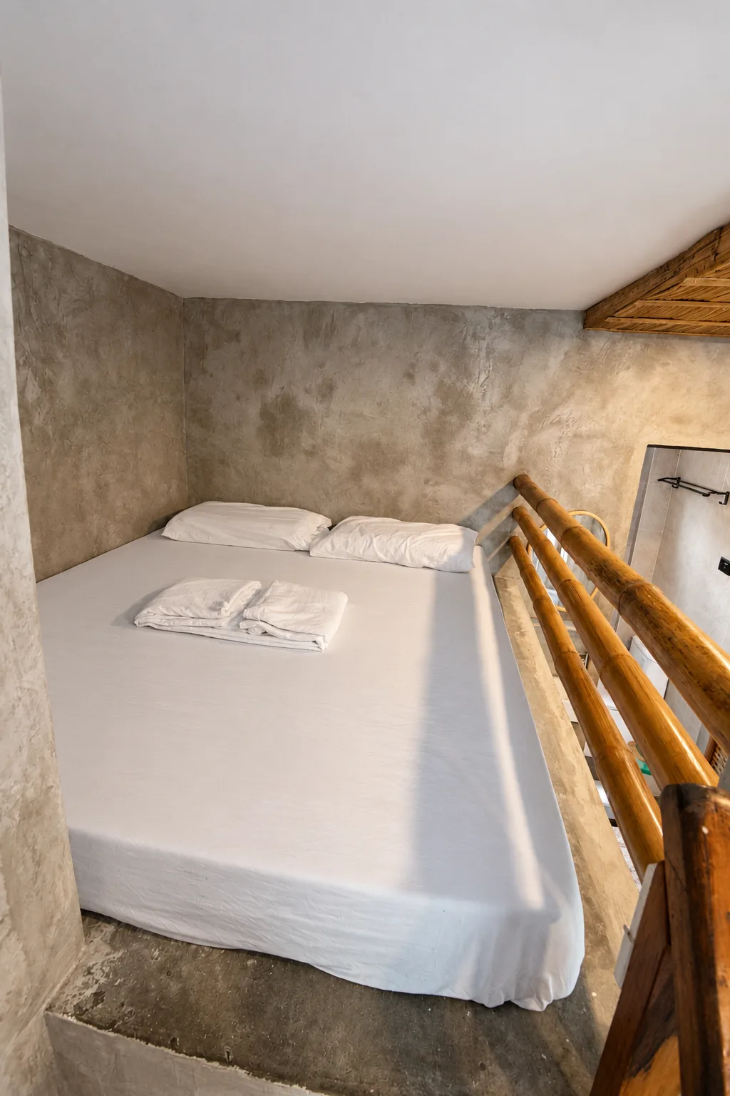 Double bed on the loft of a Budget Aircon room