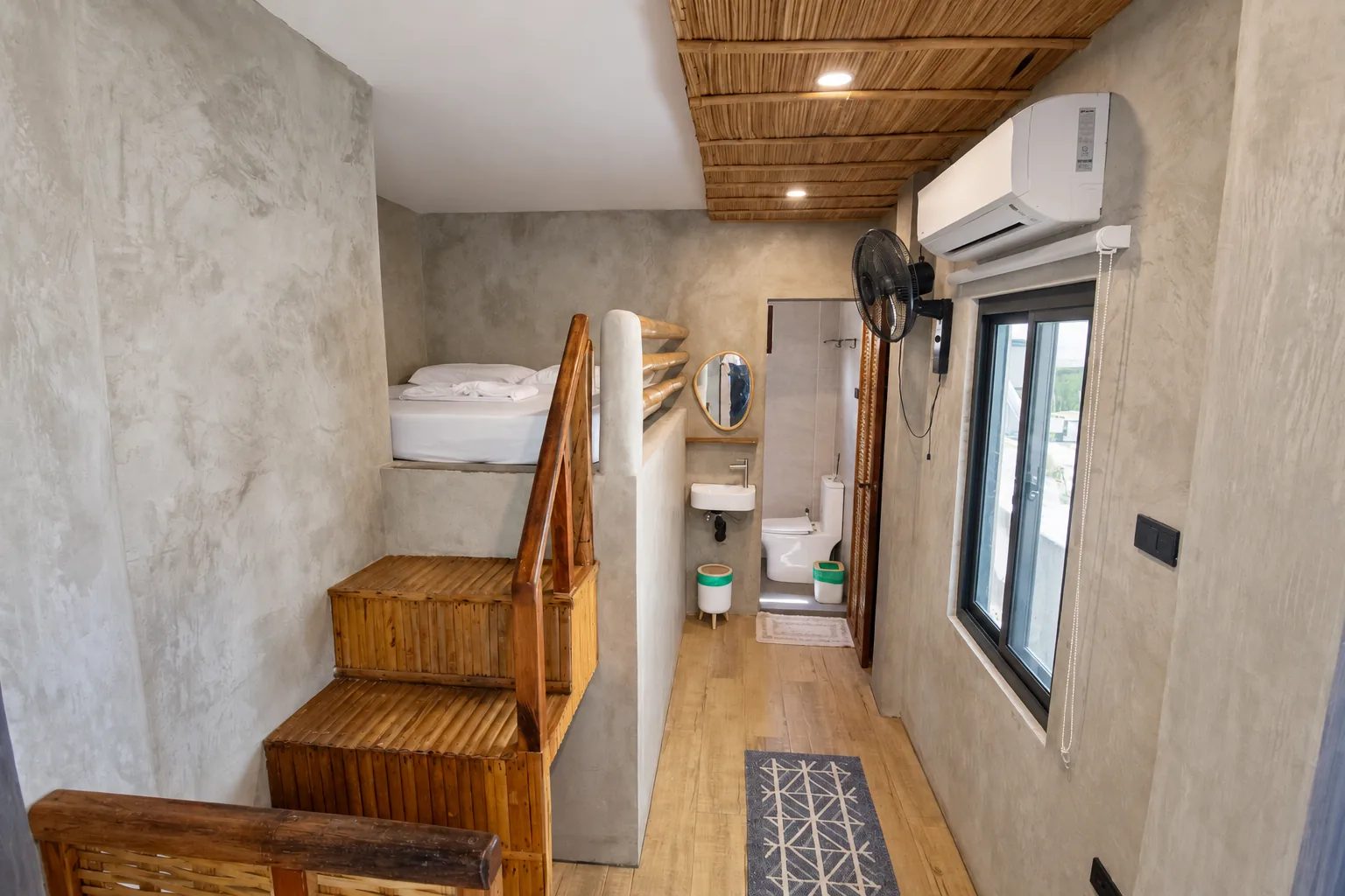 Budget Aircon loft room with stairs up to the bed and a private bathroom