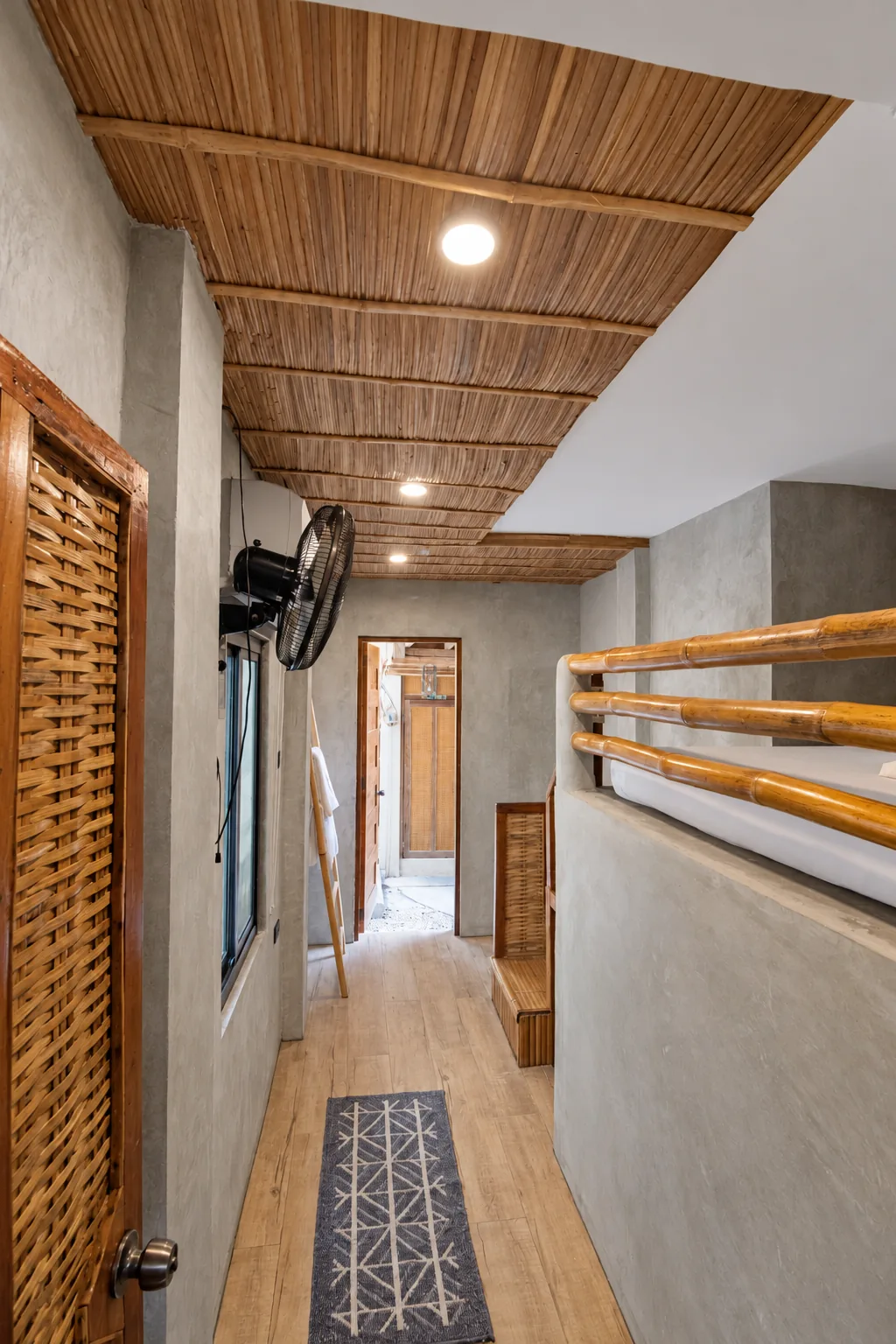 Budget Aircon loft room with bamboo ceiling and fan