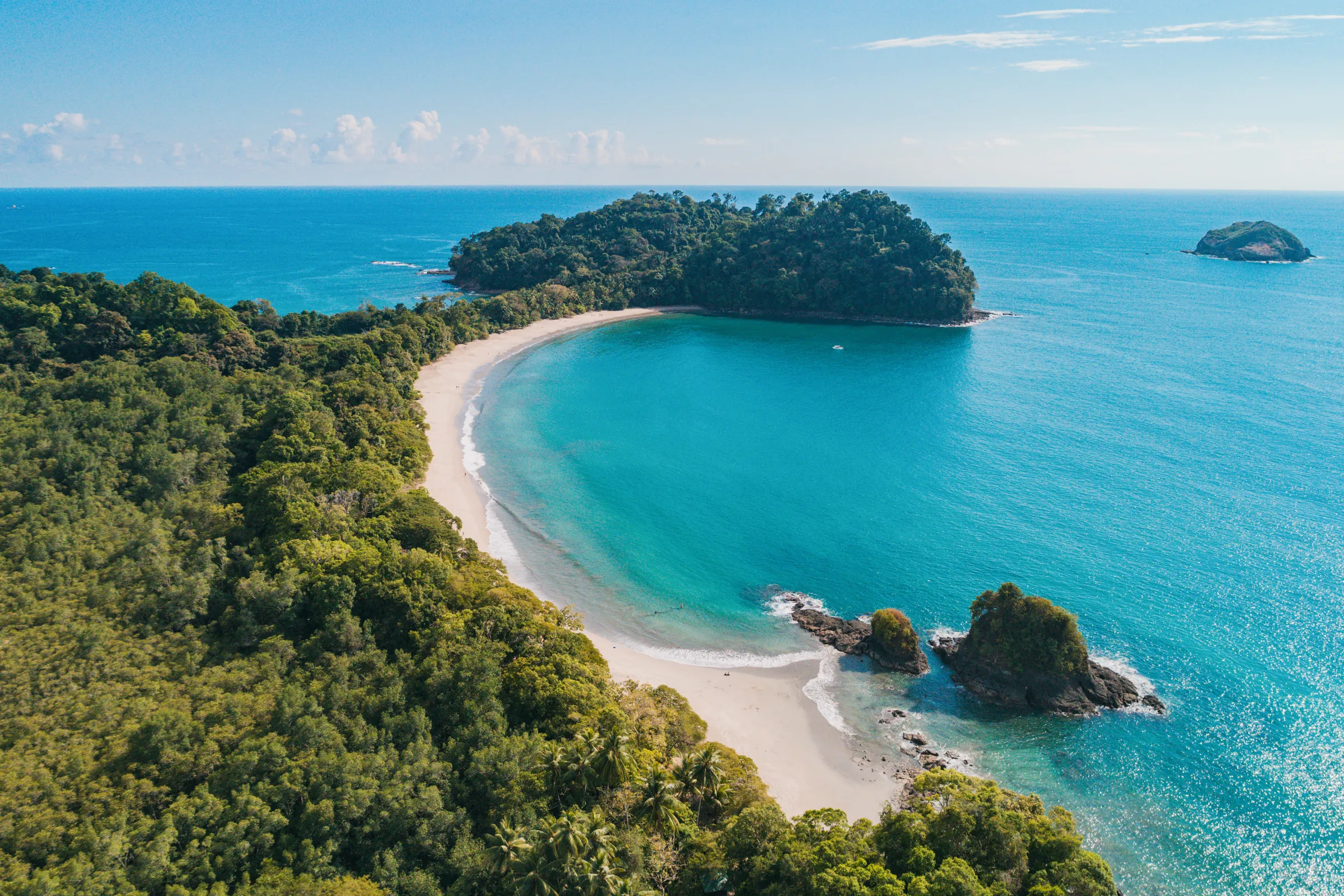 Aerial view of Punta Catedral and the curved beach at Manuel Antonio, Costa Rica