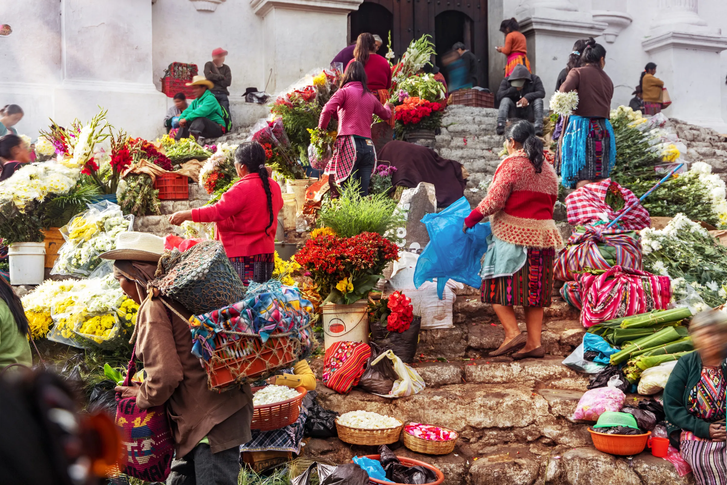 Flower vendors on the church steps in Chichicastenango, Guatemala