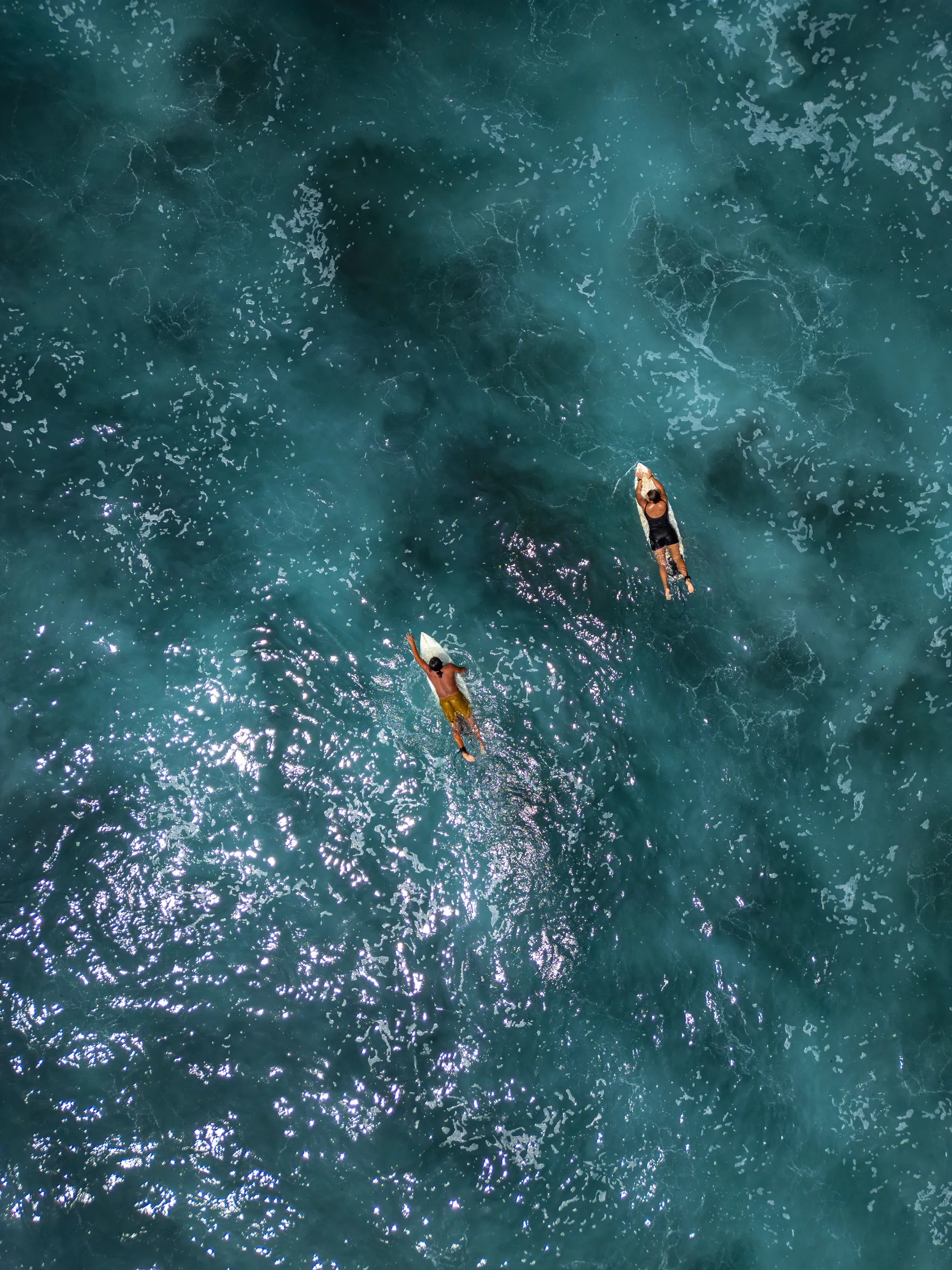 Aerial view of surfers paddling off Nicaragua’s Pacific coast