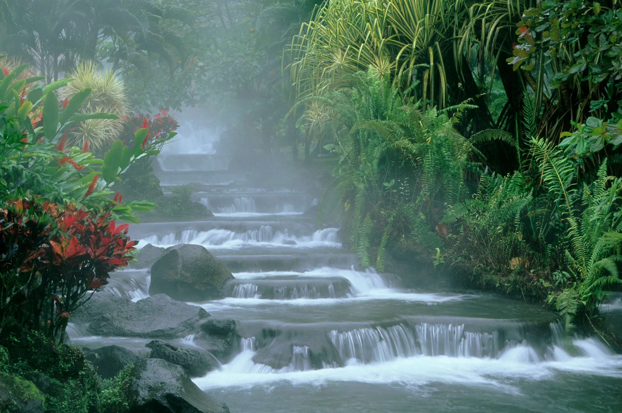 Misty hot spring cascades in Costa Rica