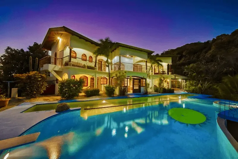 The villa and pool at dusk at Jungle's Edge