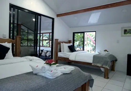 Casita beds with a garden view through the window