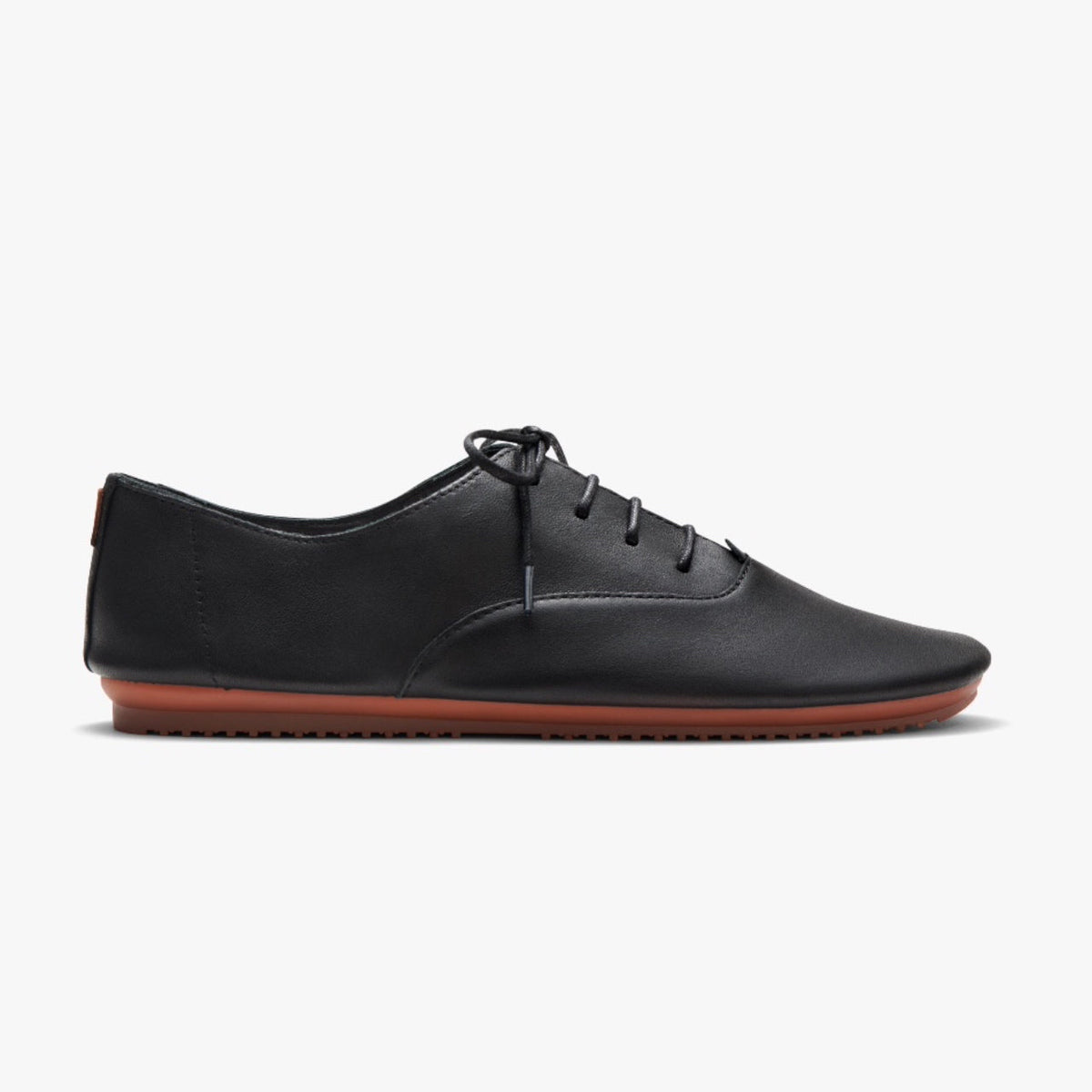 Woman wearing Lucie II flats in Smooth Black