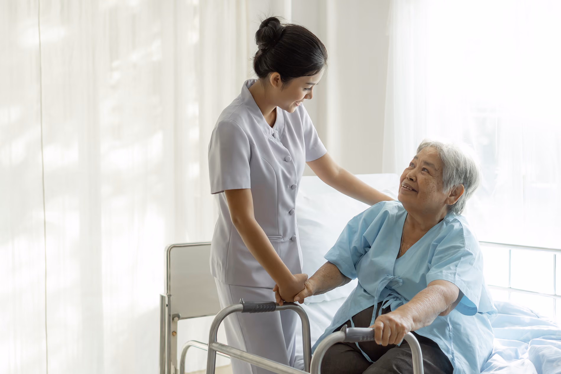 Nurse helping a patient with a walker