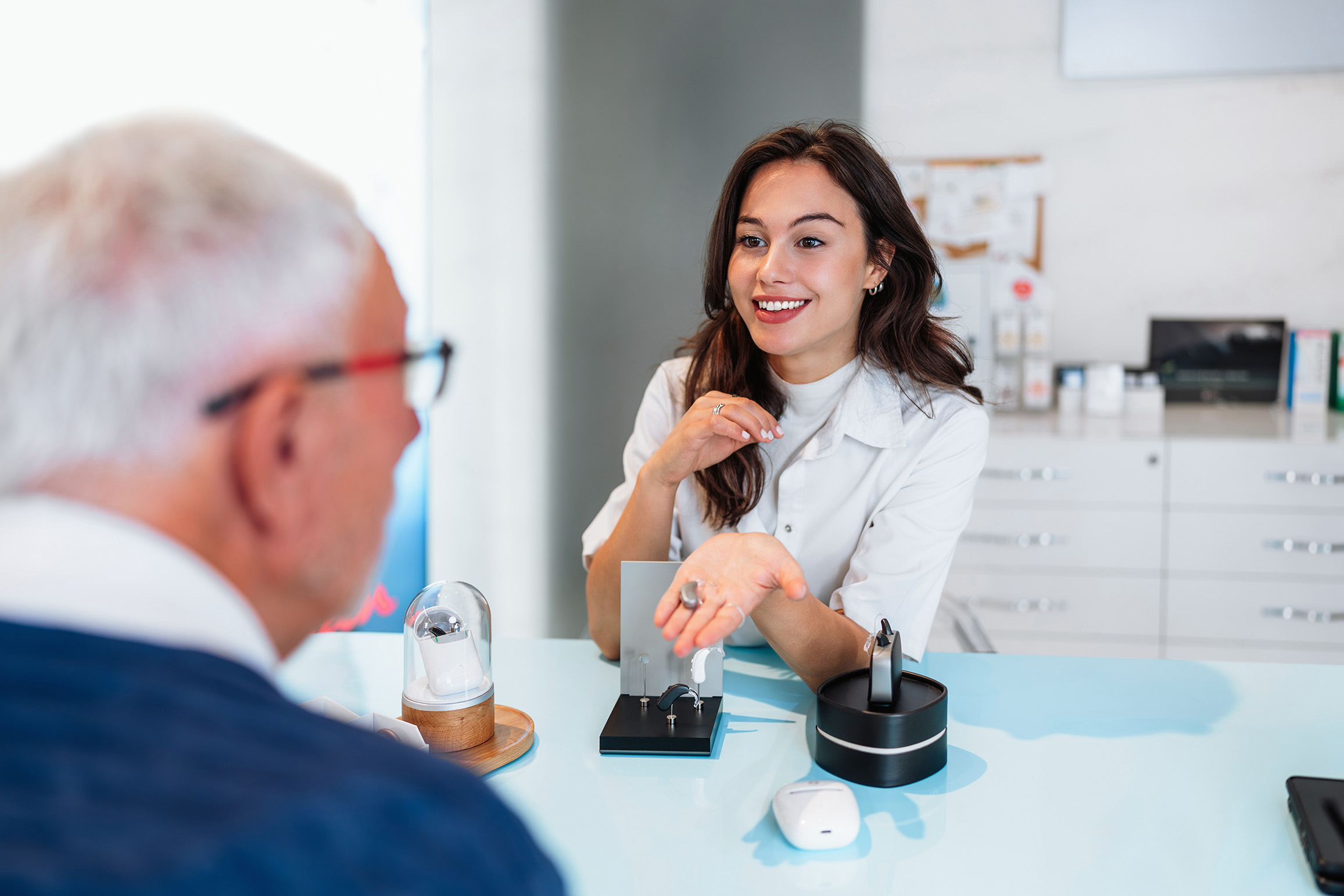 Hearing care professional talking with a patient