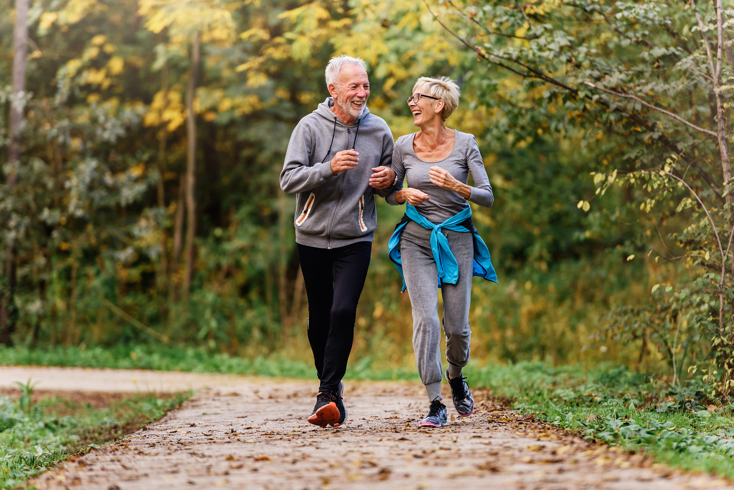 Active senior couple walking outdoors