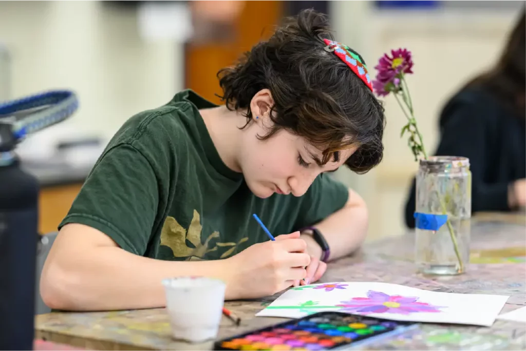 Student painting in Arts Studio