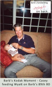 Casey holding his three month old grandson, Wyatt, feeding him his bottle