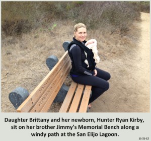 Daughter Brittany and her newborn, Hunter Ryan Kirby, sit on her brother Jimmy’s Memorial Bench along a windy path at the San Elijo Lagoon.