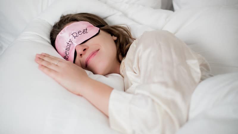 Woman sleeping with sleep mask