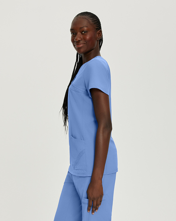 Photo of White Cross Scrubs Mock Wrap Solid Top Color Ceil Blue Side Vue 009