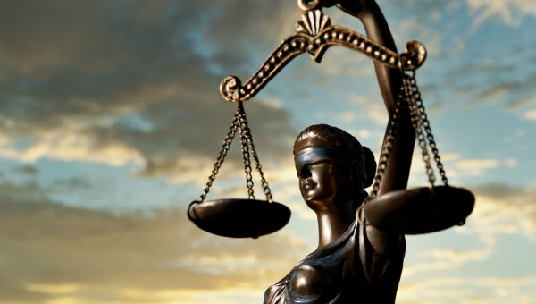 Lady Justice with sky background 600 x 340.jpg