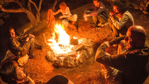 people around campfire at night 600 x 340.jpg