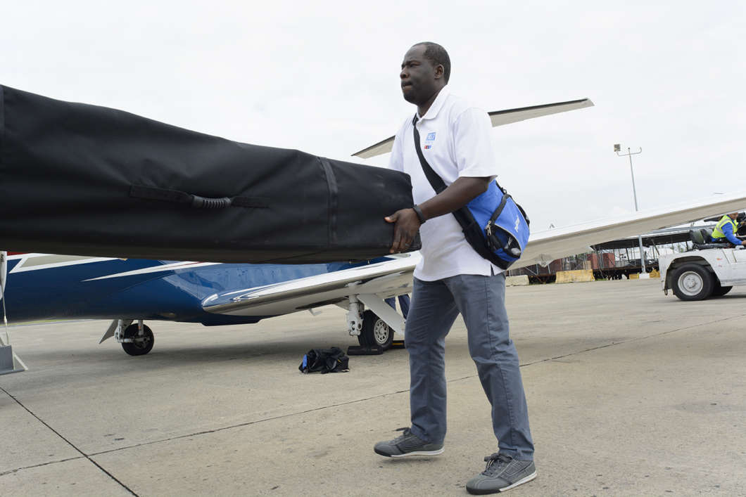LaFontaine Oliver unloading a portable radio transmitter at an airport in San Juan, Puerto Rico, in October 2017. The equipment was destined for a public radio station in Puerto Rico who lost power after Hurricane Maria. Photo: Eric Breitenbach