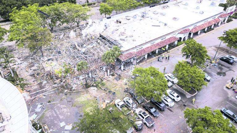 A gas explosion at Pizzafree, a pizza parlor across from the Fountains Plaza in Plantation, on Saturday, July 6, injured 23 people and caused the windows to blow out at LA Fitness. via MATIAS OCNER / MIAMI HERALD