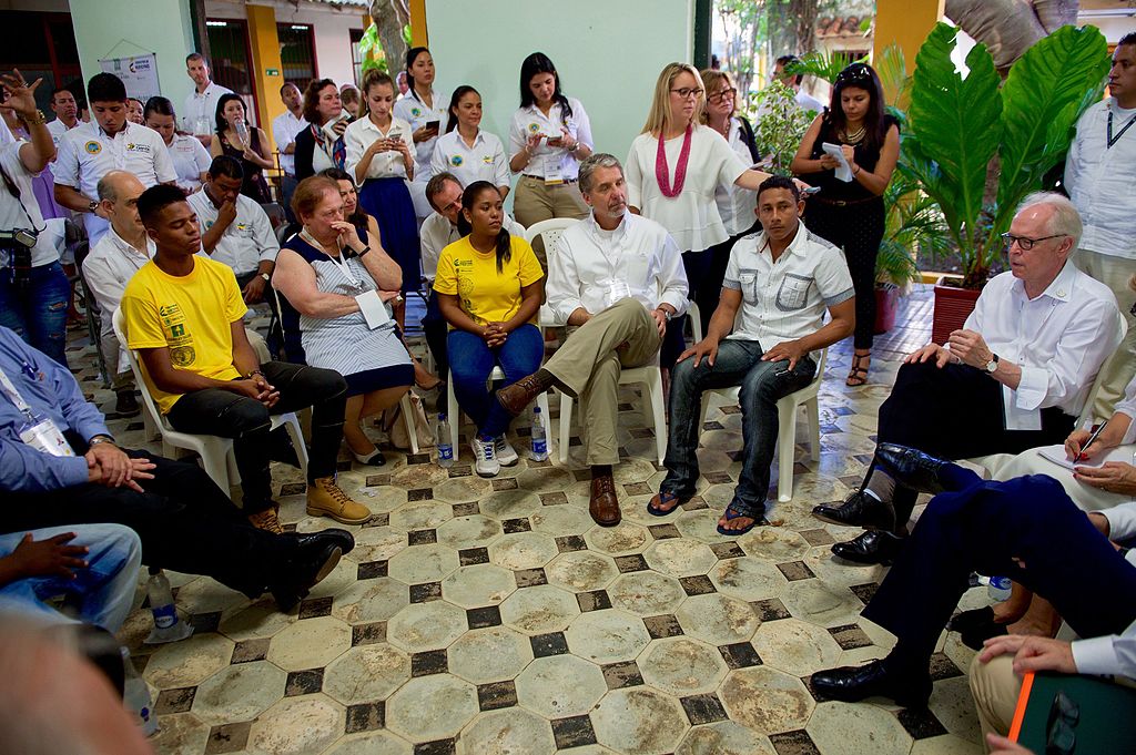 U.S. Special Envoy for the Colombian Peace Process Bernard Aronson, joined by U.S. Secretary of State John Kerry and U.S. Ambassador to Colombia Kevin Whitaker, addresses conflict victims, ex-combatants, and at-risk youth speak about a job-training program at the Escuela Taller run by the Colombian Ministry of Culture as the delegation visits Cartagena, Colombia, on September 26, 2016, to witness a peace ceremony between the government and the Revolutionary Armed Forces of Colombia (FARC) that ends a five-decade conflict.