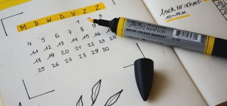 How to Schedule Your Week for Maximum Happiness A calander in a notebook