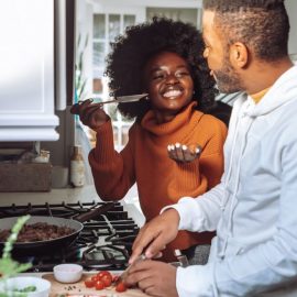 happy couple cooking