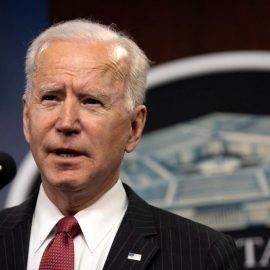 President Joe Biden talking into a microphone.