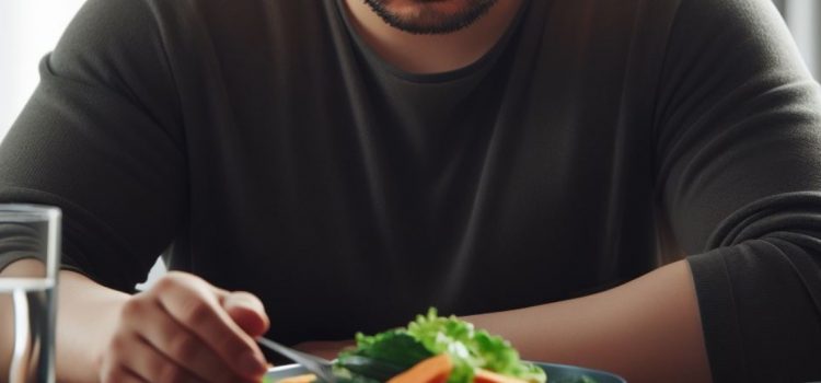 How to Fast Safely: 2 Tips to Get the Most Out of Your Diet A man intermitting fasting while looking at a plate of veggies and water.