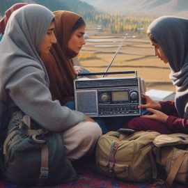 Pakistani women listening the radio in the mountains