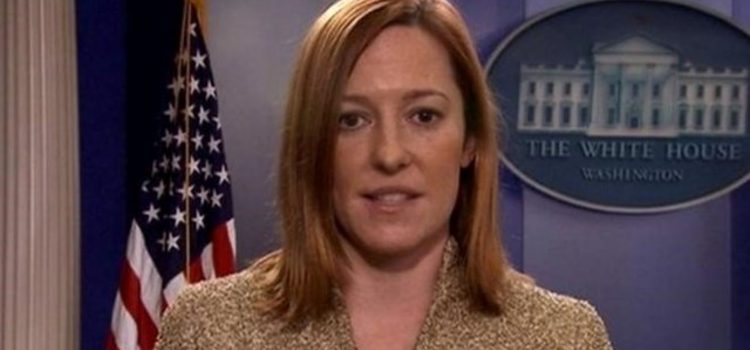 Overview of Jen Psaki’s Smartless Podcast Appearance Jen Psaki in the White House briefing room in front of an American flag.