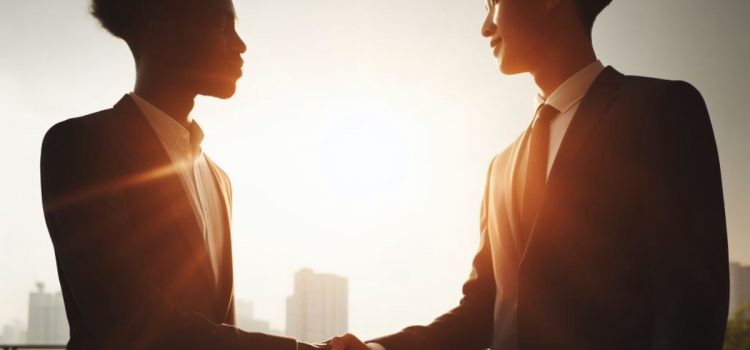 Why You Shouldn’t Look for Negotiation Compromises Two men who know how to please everyone, shaking hands with each other outside.