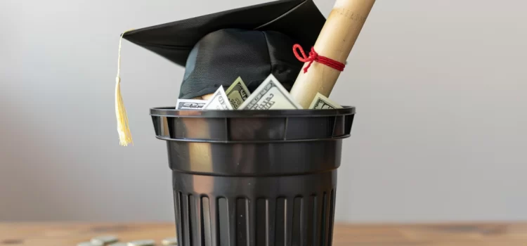 Is Going to College Worth It, Amidst Rising Costs? A college degree and graduation cap in the trash as some wonder, "is going to college worth it?"