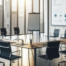 A conference meeting of empty chairs with a chart, showing the importance of business administration.
