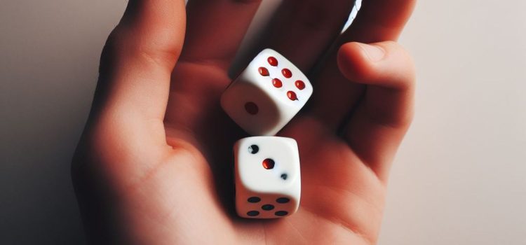 Does Quantum Indeterminacy Make Free Will Possible? A person holding a pair of dice in their hand illustrates quantum indeterminacy and free will