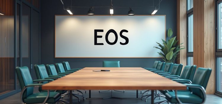 What Is the Entrepreneurial Operating System? EOS Explained A conference room with "EOS" on a whiteboard illustrates the question "What is the Entrepreneurial Operating System?"