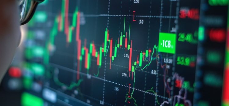 Stock Picking vs. Index Funds: Why You Should Keep It Simple A person wearing glasses looking at a digital stock market chart illustrates stock picking vs. index funds