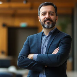 A proud manager with his arms crossed, practicing holistic leadership