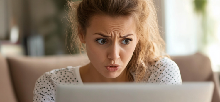 Why Do People Get Offended? Einzelgänger Explains A shocked woman looking at a laptop computer screen illustrates the question, "Why do people get offended?"