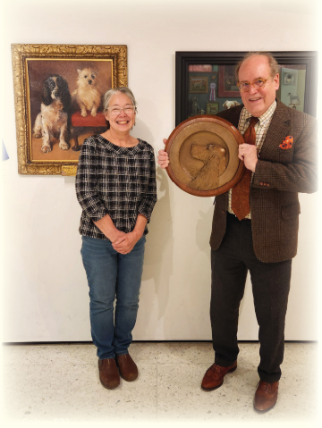 Joyce Winkels presenting the maquette to Alan Fausel at the AKC Museum of the Dog