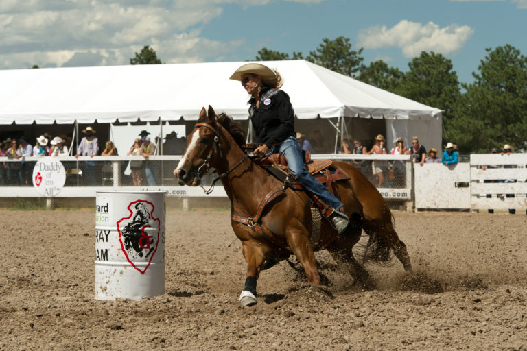 Professional barrel racer Sue Smith rounds a barrel on Real Claim Ta Fame